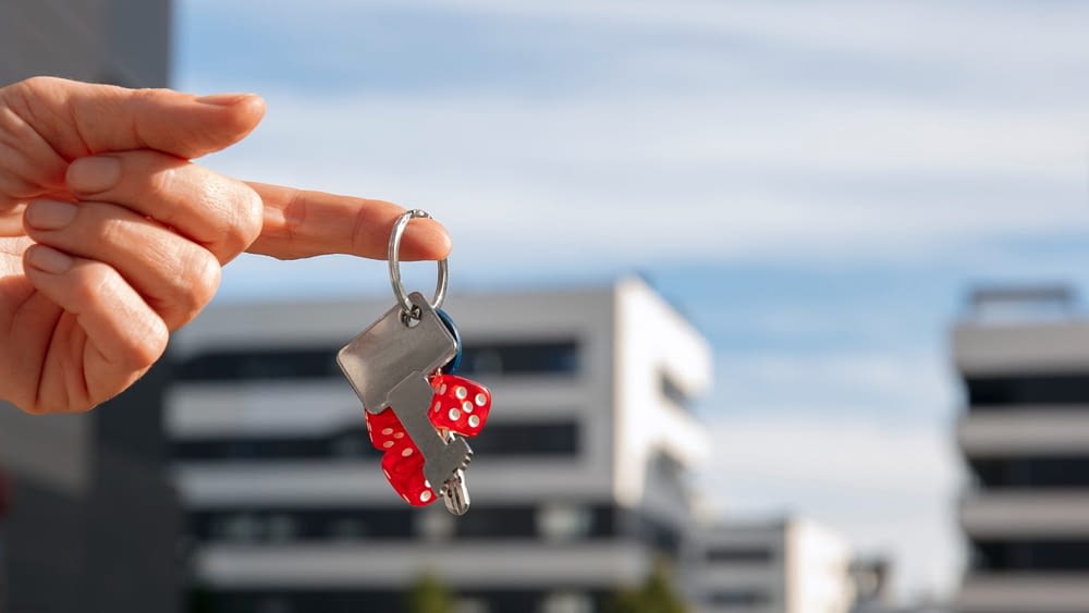 Guest holding keys to furnished apartment in Paris