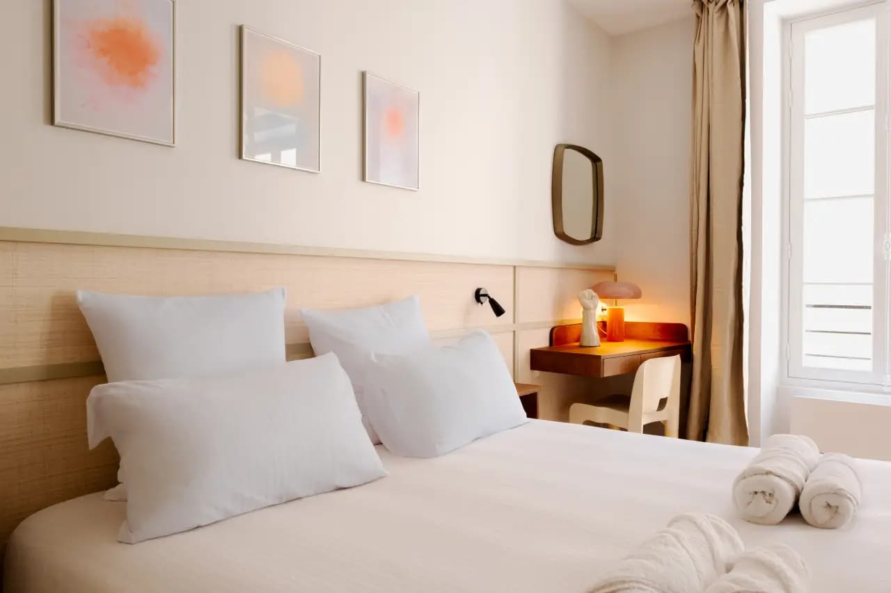 Stylish bedroom with ceiling lights and decor